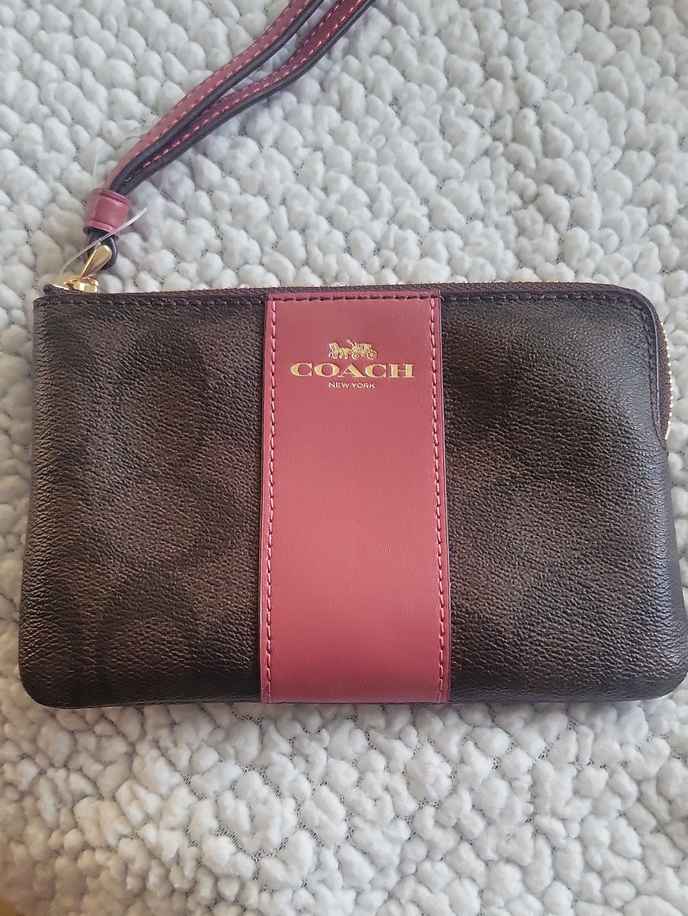 COACH Brown Wristlet with Rouge Center Stripe and Gold Logo